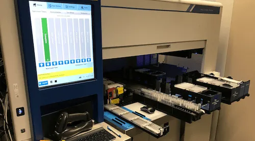 Engineers reviewing AI-assisted code and traceability on screen